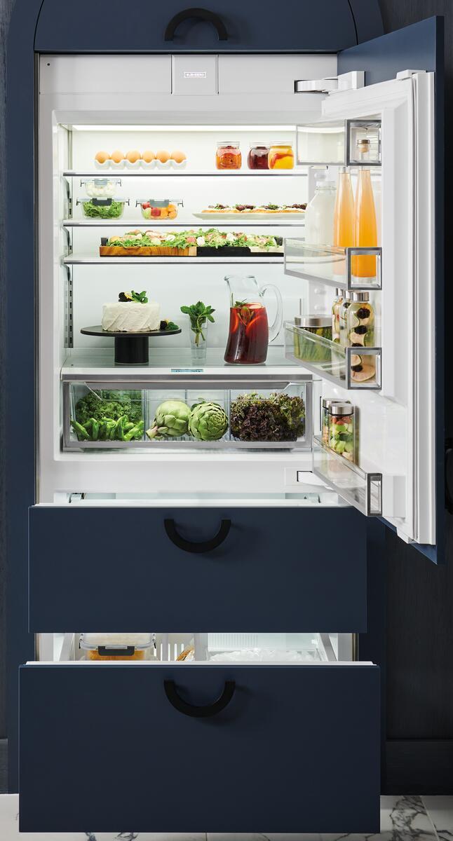 Interior view of Sub-Zero DET3650CI/R showing ClearSight LED lighting and glass shelving