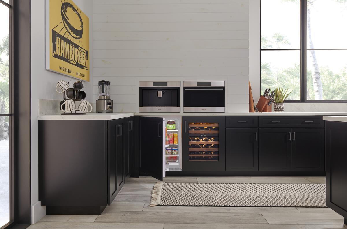 Sub-Zero DEU2450R/R Designer Series Smart Undercounter Refrigerator shown in a luxury built-in kitchen setting