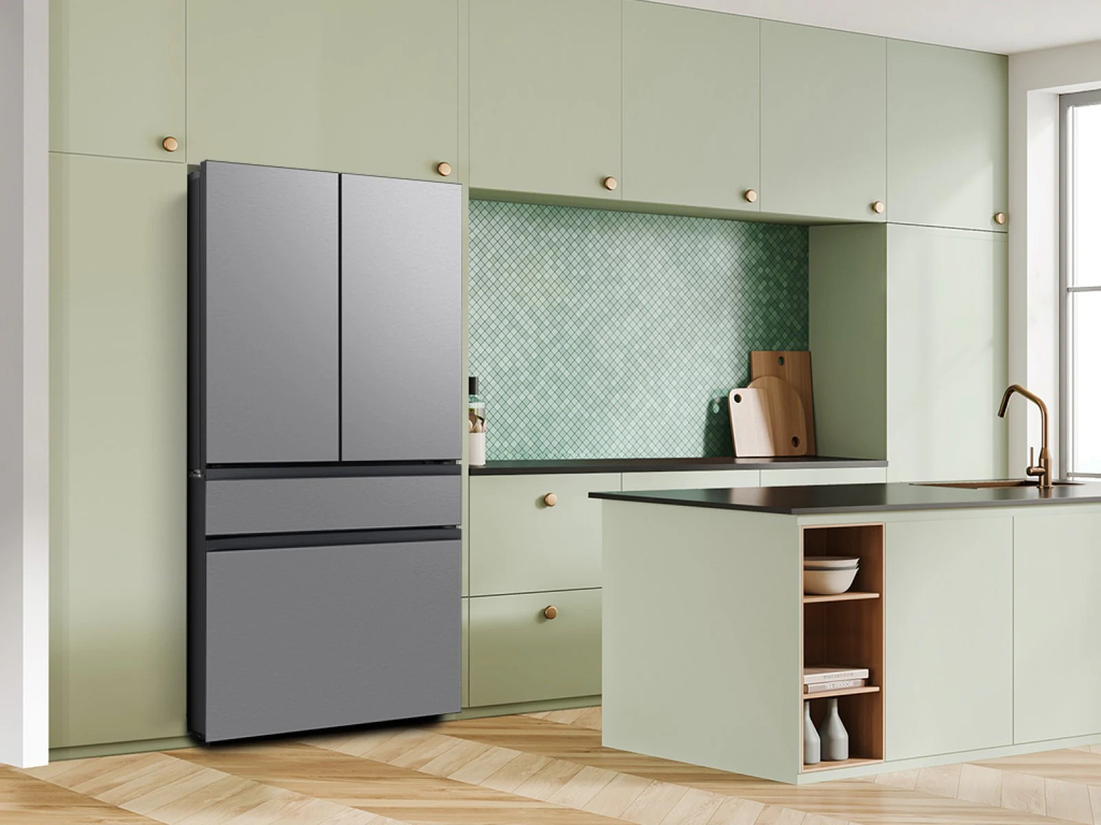 Samsung Bespoke AI 4-Door French Door Refrigerator RF70F29DERAA in Stainless Steel, installed in a modern kitchen with sage green cabinetry, a mosaic tile backsplash, warm wood flooring, and a dark countertop island with a gold faucet.